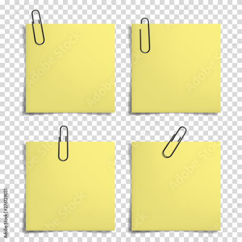 Blank notes with realistic paper clip for your text, isolated. photo