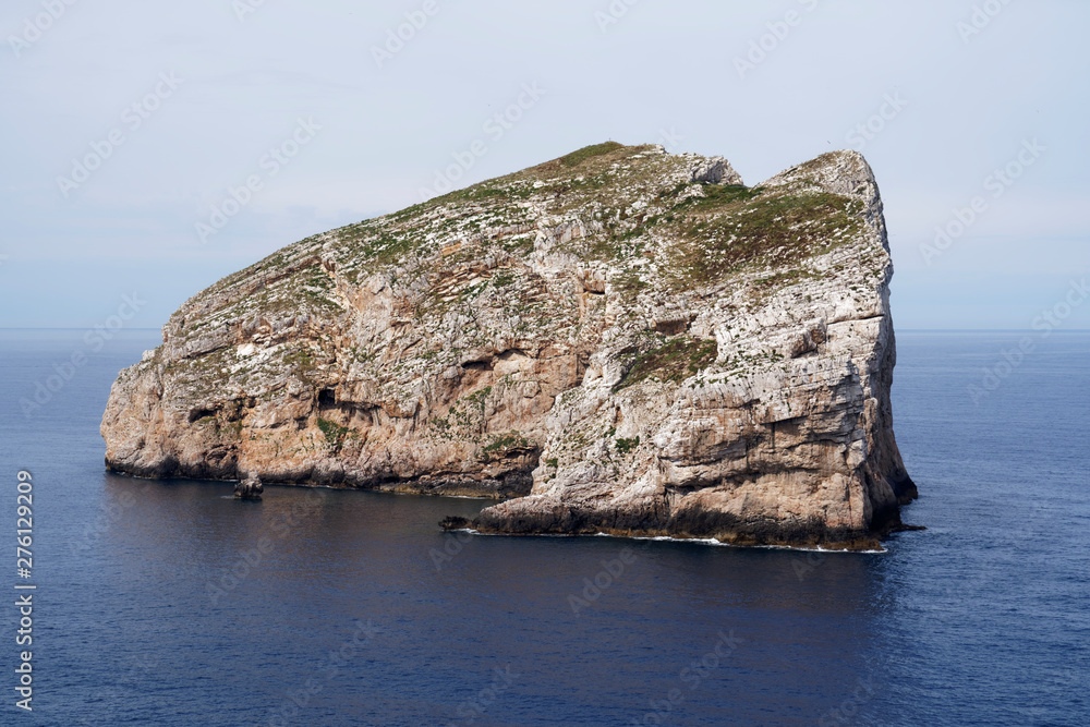 Capo Caccia, Foradada Island. Imposing white limestone cliff, in Sardinia/Sardegna, Italy