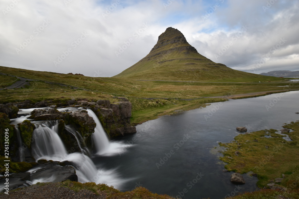 Famous kirkjufell mountain with the kirkjufell falls waterfalls in front in Grundarfjödur in Iceland