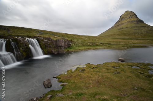 Famous kirkjufell mountain with the kirkjufell falls waterfalls in front in Grundarfjödur in Iceland