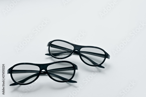 Two pairs of 3d glasses for cinema. Watching movie in 3d. Black glasses.