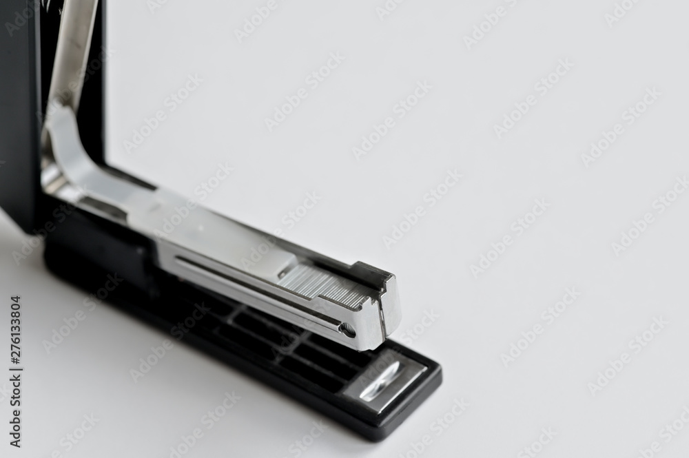Stapler black with paper clips isolated on white background. Stapler black with paper clips isolated on white background.