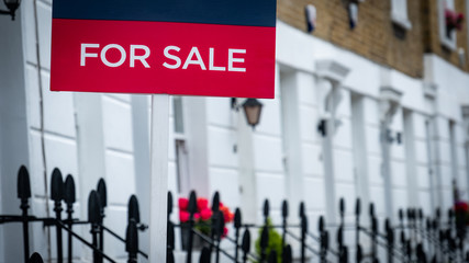 Estate agent 'For Sale' sign on British street