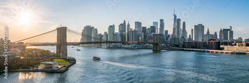New York City skyline panorama at sunset with Brooklyn Bridge