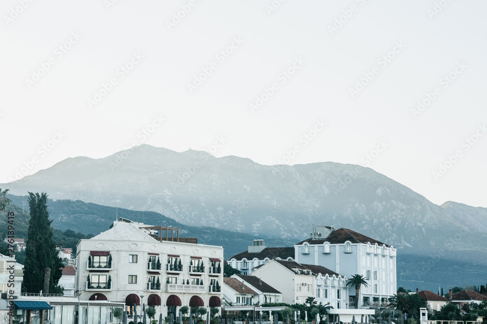 View of the mountains and the traditional urban architecture in Tivat in Montenegro. Resort town.