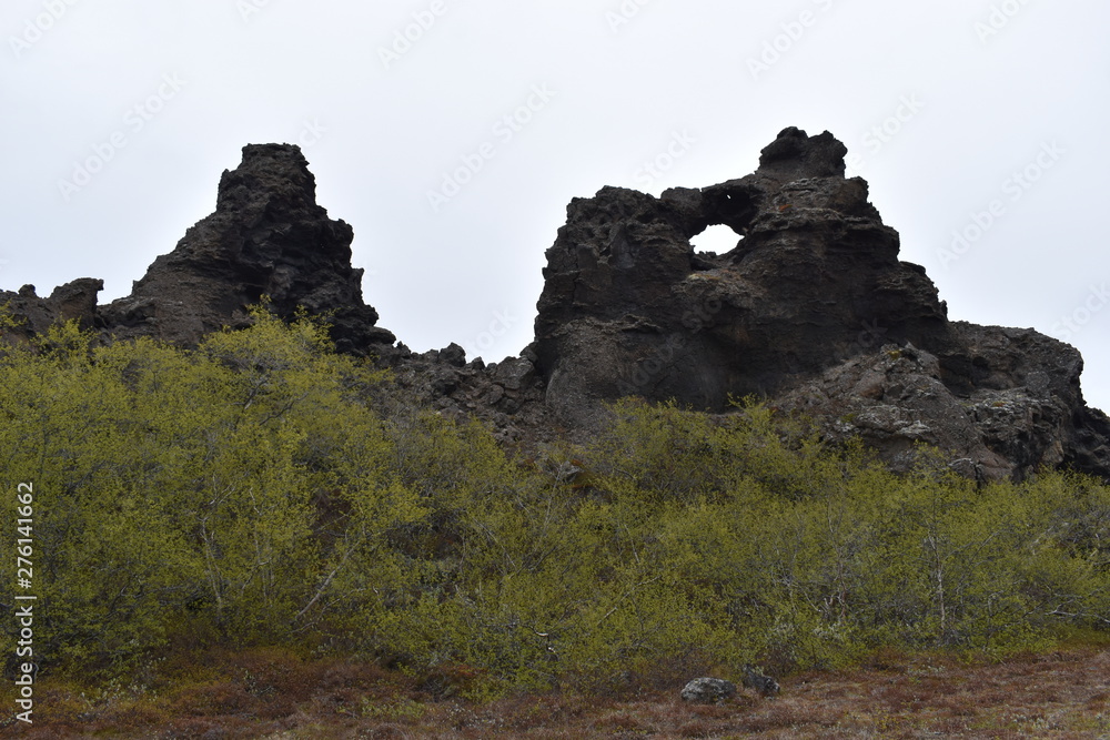 Big hole in the rock at lava field Dimmu Borgir in Myvatn, Iceland Big hole in the rock at lava field Dimmu Borgir in Myvatn, Iceland
