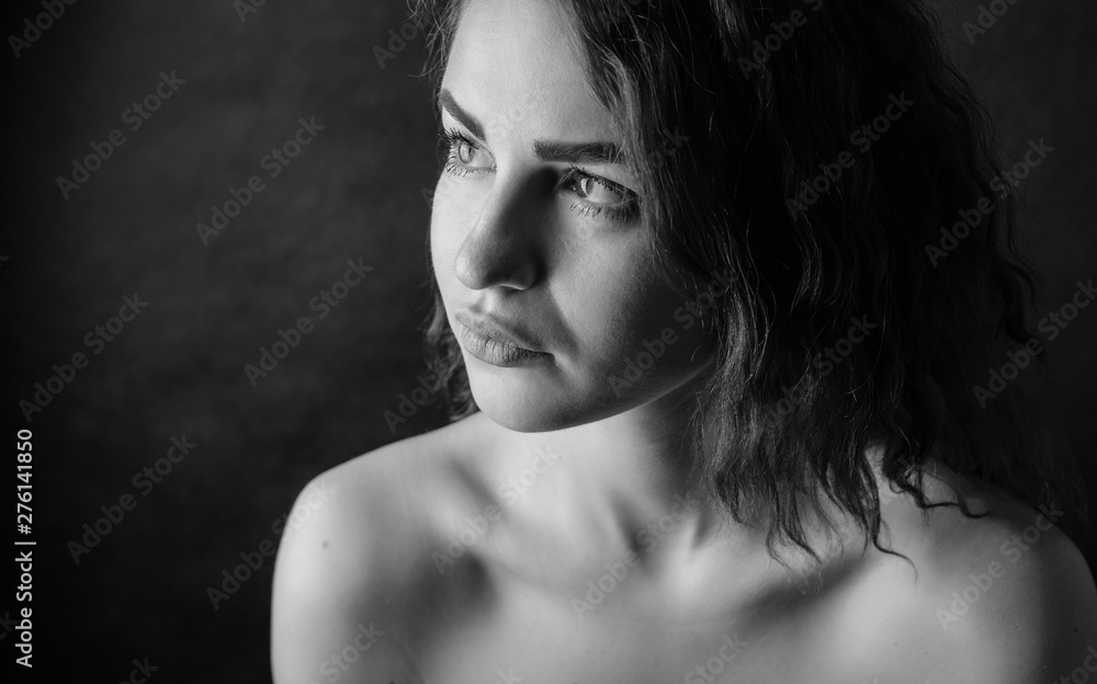Black and white portrait of beautiful young woman. Selective focus. Black and white portrait of beautiful young woman. Selective focus.