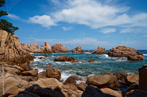 Stunning red rock formation at beach with turquoise blue sea at La Sorgente, Costa Paradiso in Sardinia (Italy)  © Adrian