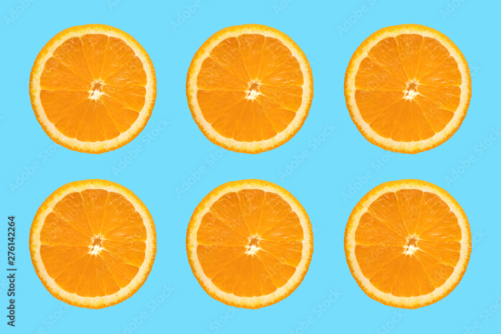 Juicy orange slice on blue background. Sliced Citrus Fruits Juicy orange slice on blue background. Sliced Citrus Fruits