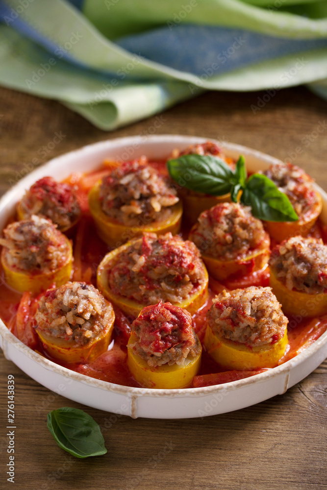 Zucchini stuffed with meat, rice and vegetables in tomato sauce. Loaded zucchini Zucchini stuffed with meat, rice and vegetables in tomato sauce. Loaded zucchini