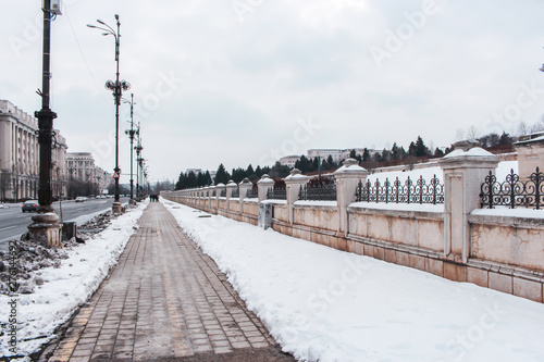 The image of snowy sidewalk in front of the Palace of the Parliament (Casa Poporului / Palatul Parlamentului), Sector 5, Bucharest, Romania. © Koshiro