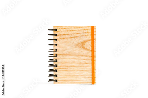 Notepad on spiral with solid wood cover isolated on white background.
