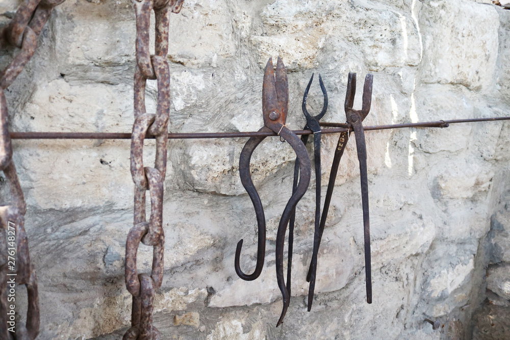 Old rusty blacksmith tools on the stone
