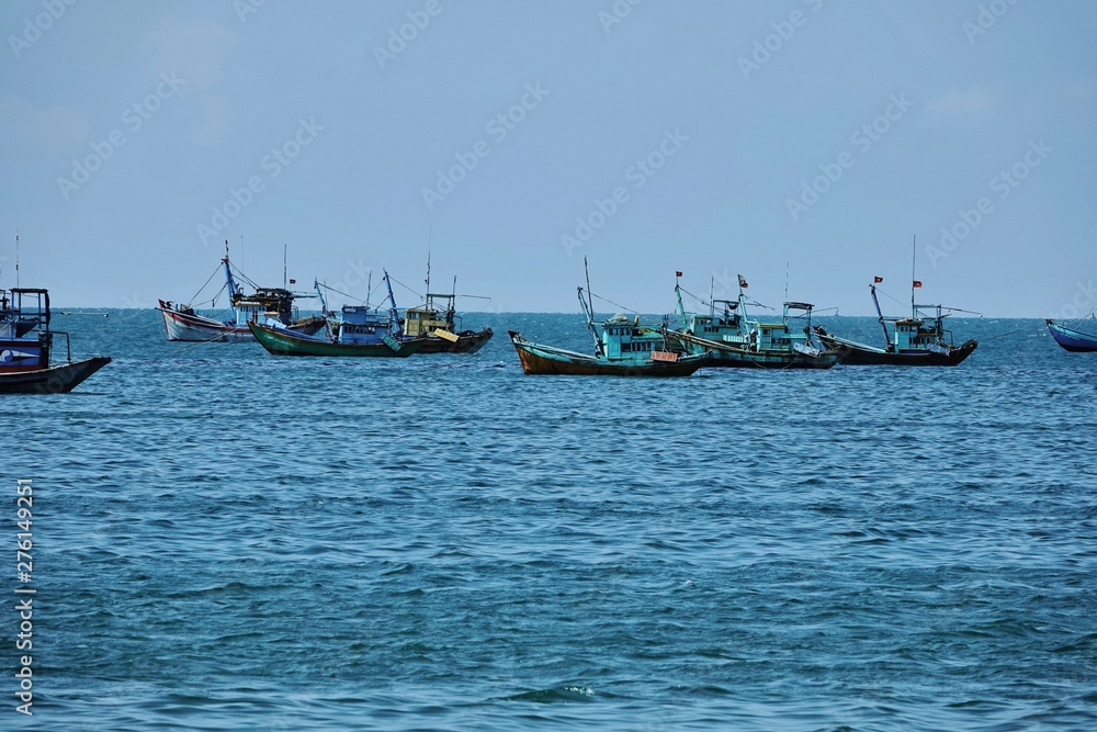 pier and basket boats in asian fishing village