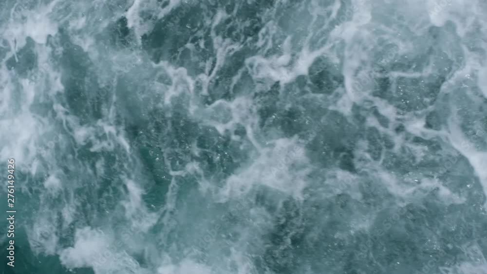 Abstract slow motion water ocean waves texture background. surface of sea wave splash and foam. Abstract slow motion water ocean waves texture background. surface of sea wave splash and foam.