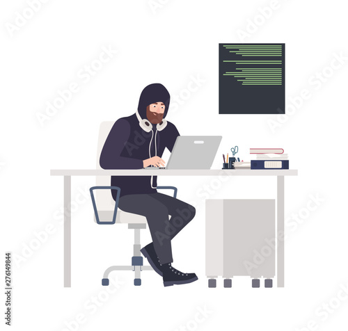 Male thief or hacker wearing black clothes, sitting at desk, hacking computer and stealing personal information