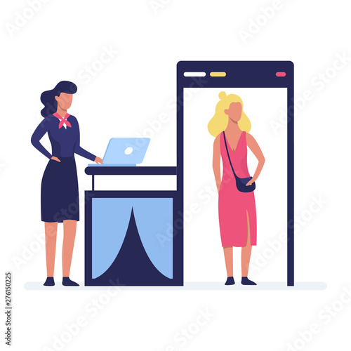 Woman going through the metal scanner. Security control