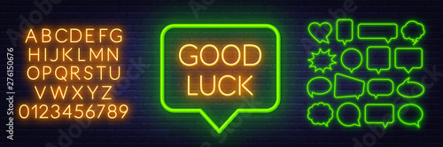 Neon sign good luck in speech bubble frame on dark background. Set of neon speech bubbles and the alphabet on a dark background.