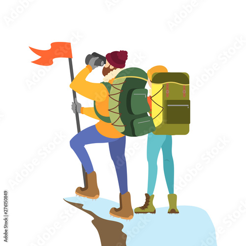 Climber couple standing on the mountain peak with flag