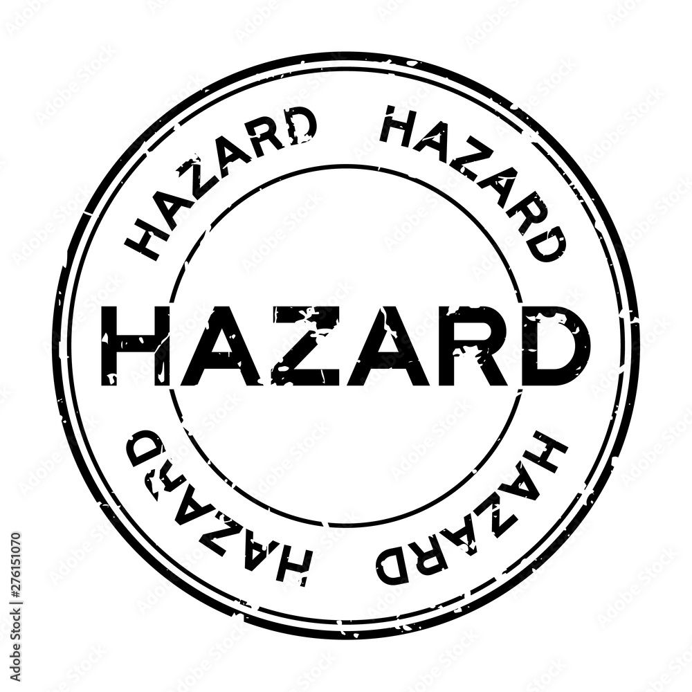 Grunge black hazard word round rubber seal stamp on white background