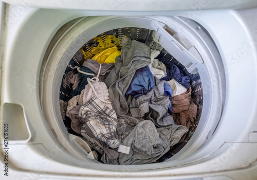 Unclean clothes in washing machine © Mumemories