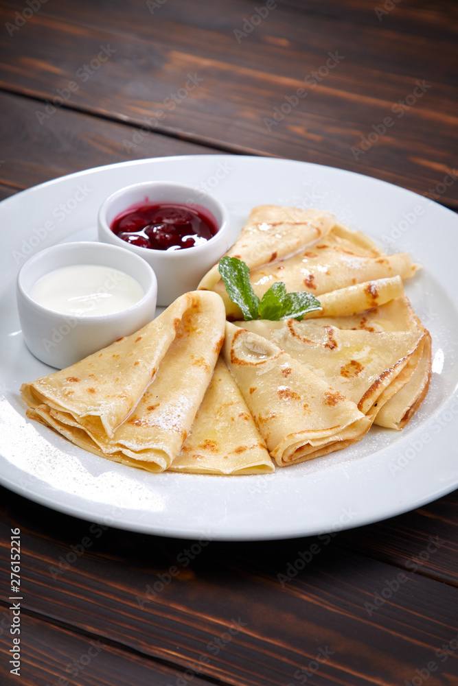 pancakes with sour cream and berry sauce pancakes with sour cream and berry sauce