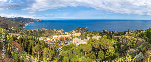 Panoramic aerial view of Giardini-Naxos bay and Ionian sea coast near Isola Bella island and Taormina town, Sicily, Italy