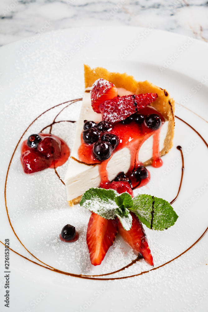 cheesecake with fresh strawberries and mint - obrazy, fototapety, plakaty 