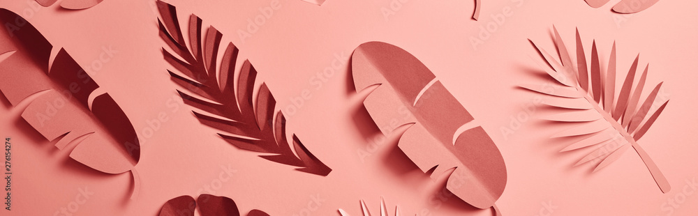 panoramic shot of paper cut palm leaves on pink background, seamless pattern - obrazy, fototapety, plakaty 