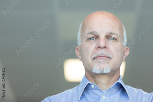 Canvas Print Senior balding man with a deadpan expression