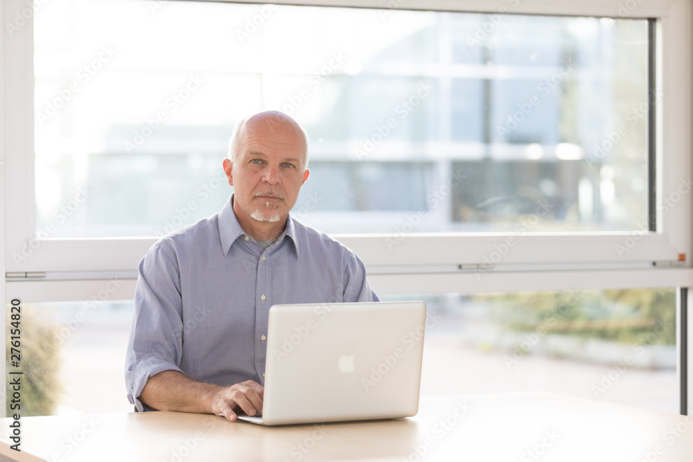High key portrait of a senior businessman High key portrait of a senior businessman
