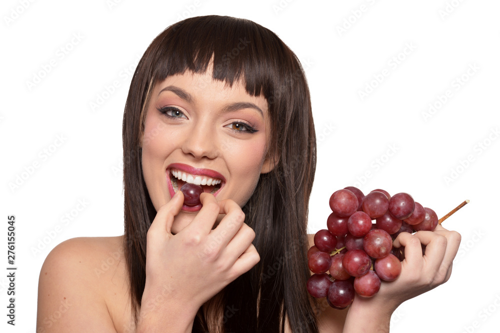 Portrait of young woman posing with grapes Portrait of young woman posing with grapes