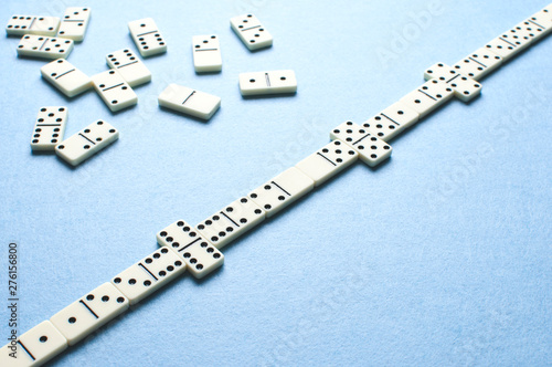 White domino pieces on a blue background.
