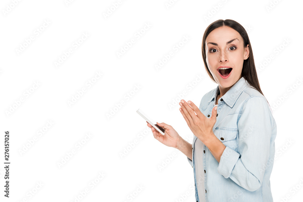 side view of excited young woman using smartphone isolated on white side view of excited young woman using smartphone isolated on white