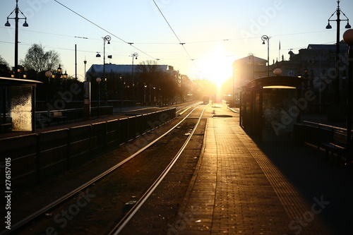 Early winter morning on a tram stop with strong sunlight on the Avenue, Gothenburg, Sweden photo