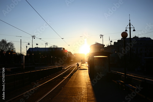 Early winter morning on a tram stop with strong sunlight on the Avenue, Gothenburg, Sweden