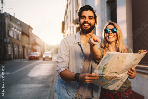 Smiling couple travelling and having fun in the city. Summer holidays, dating and tourism concept.