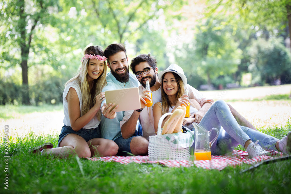 Happy young friends having fun outside in nature, taking selfie Happy young friends having fun outside in nature, taking selfie