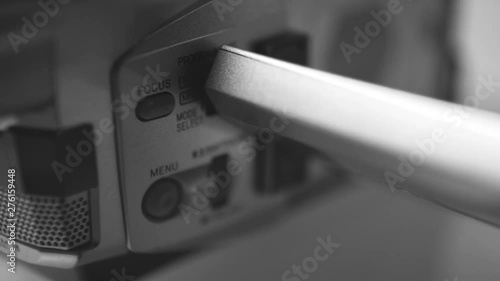 Manual button dial of a mini dv camcorder camera, close up macro shot