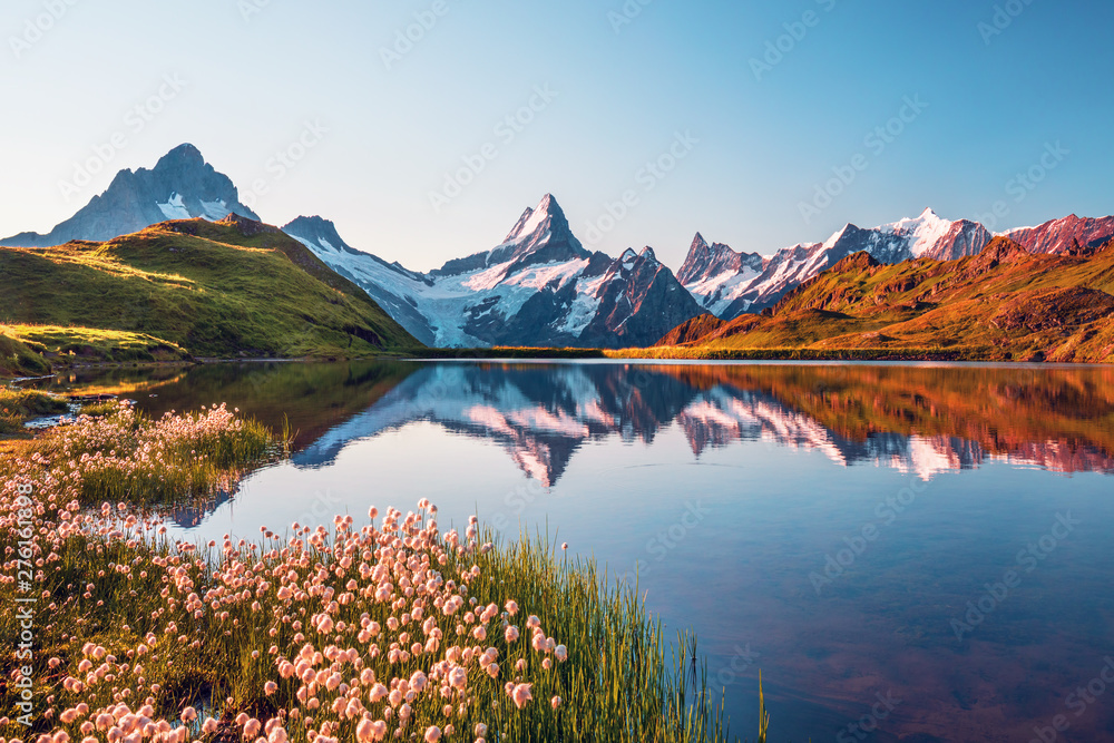 Sunrise  view on Bernese range above Bachalpsee lake. Popular tourist attraction. Location place Switzerland alps, Grindelwald valley, Europe. 