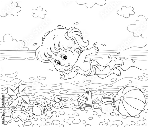 Little girl swimming in sea...