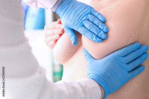 Plastic surgeon checks with his hands state silicone