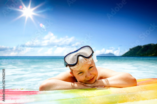Small girl in sea and summer time. Free space for your decoration 