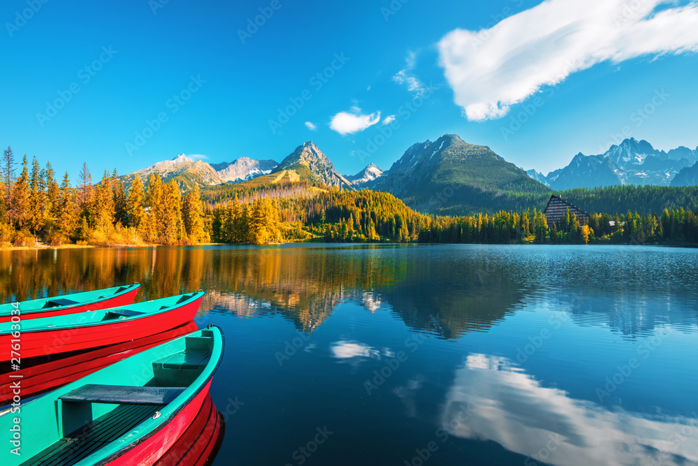 Obraz premium Sunrise view in High Tatras mountains national park and Strbske pleso (Strbske lake) beautiful mountain lake in Slovakia
