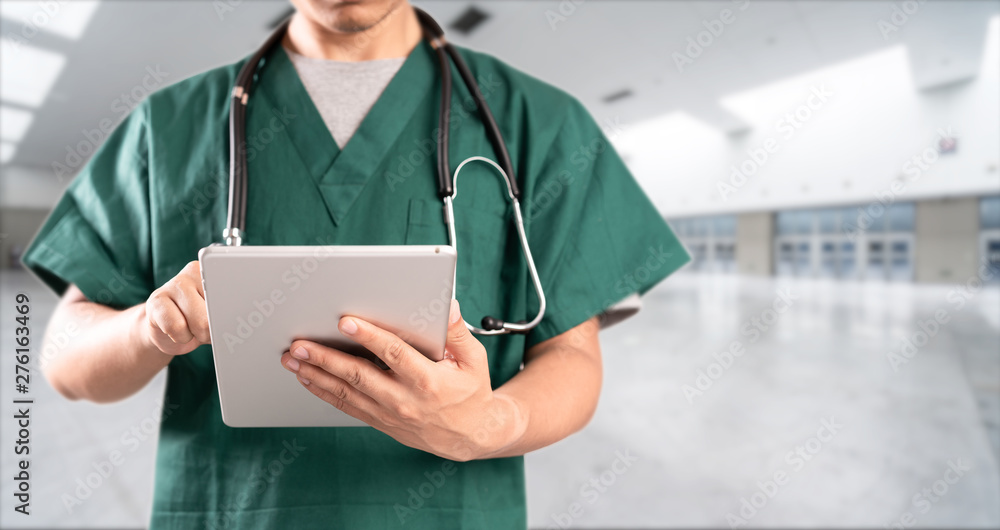 young doctor with hospital background young doctor with hospital background