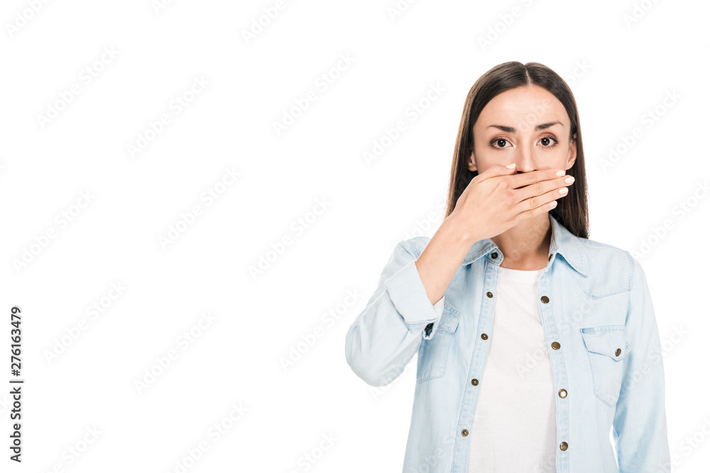 brunette woman covering mouth with hand isolated on white brunette woman covering mouth with hand isolated on white