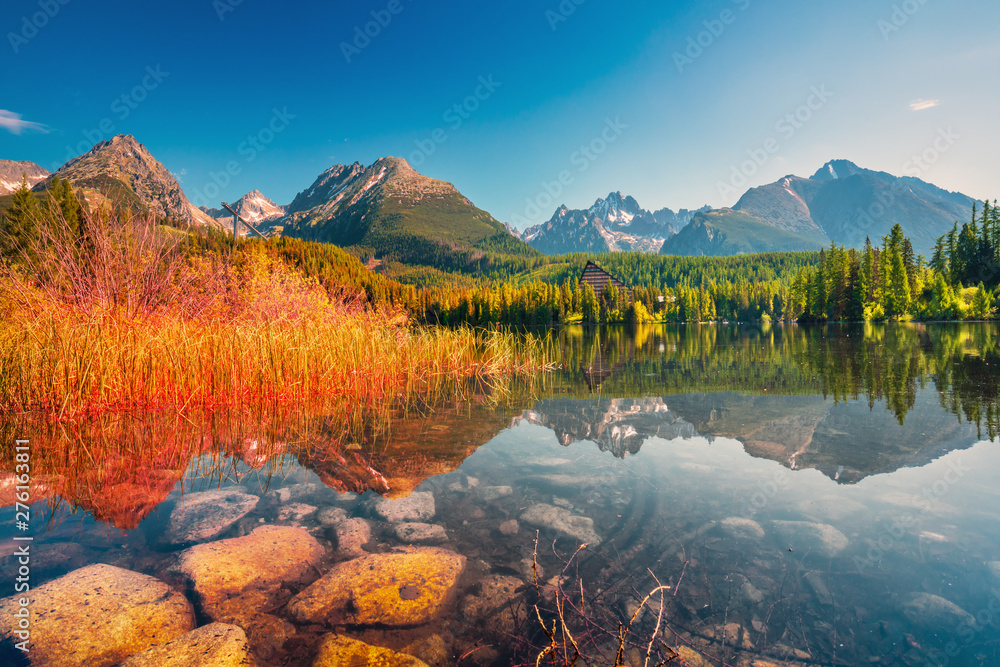 Sunrise view in High Tatras mountains national park and Strbske pleso (Strbske lake) beautiful mountain lake in Slovakia