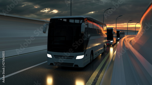 A convoy of three white buses drive on a highway at sunset backlit by a bright orange sunburst under an ominous cloudy sky. 3d Rendering