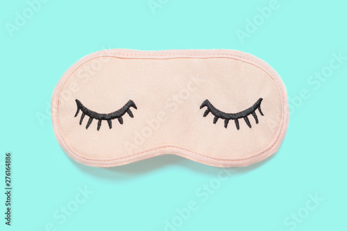 Wallpaper Mural Pastel pink sleep mask with closed eyes embroidered on it with eyelashes on turquoise background. Top view, flat lay. Concept of vivid dreams. Accessories for girls and young women. Minimal style Torontodigital.ca