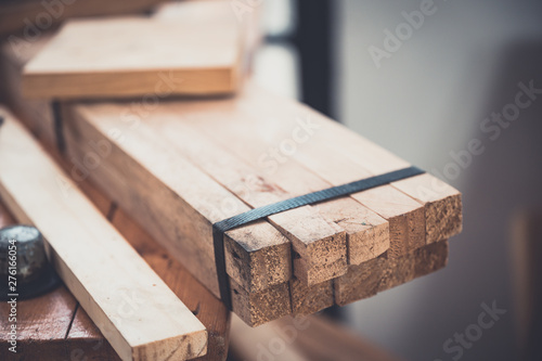 Background image of woodworking workshop, carpenters work table with different tools and wood cutting stand, vintage filter image